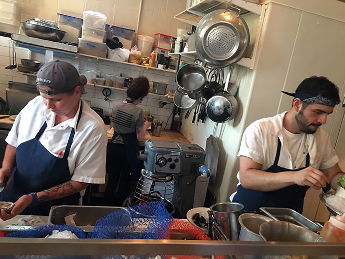 Oyster shucker on left; oyster arranger on right