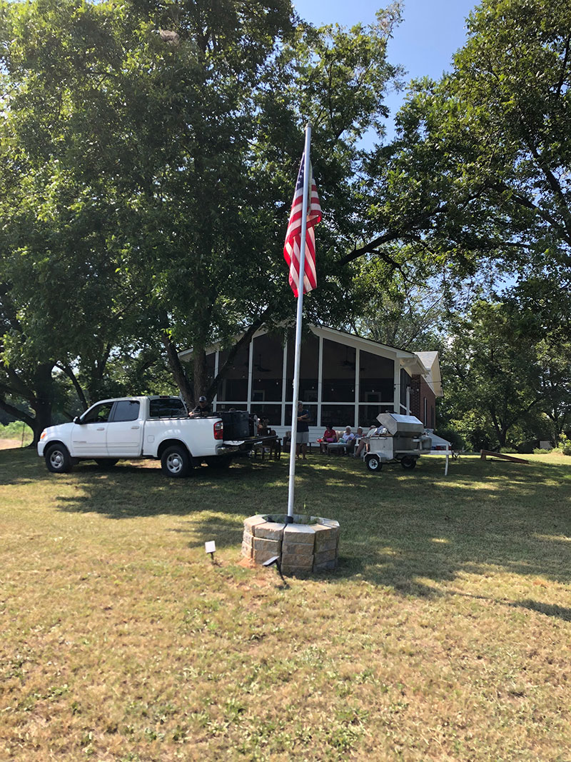 Beautiful Toyota Tundra, farmhouse, and flag.